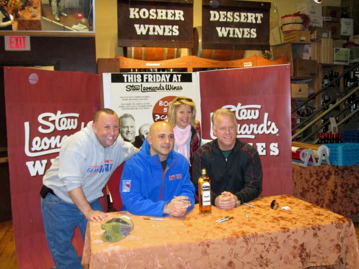 Yonkers resident Sal Fata (left) talked sports with radio show hosts Craig Carton (middle) and Boomer Esiason at Stew Leonards Wines. 