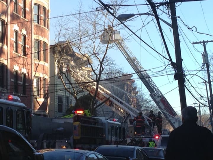 Yonkers firefighters battled a four-alarm fire Monday on Saratoga Avenue.