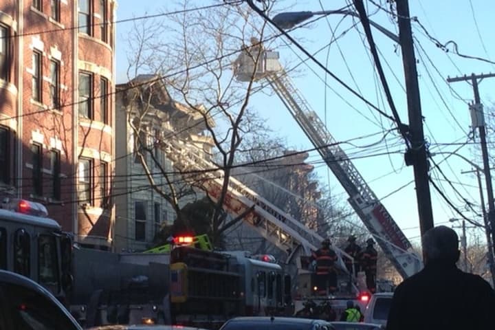 A Saratoga Avenue apartment building was in the process of being demolished Tuesday after a fire the day before. 