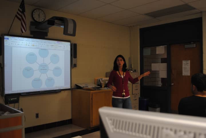 Ossining High School business teacher Debra Jacoby speaks to accounting students. 