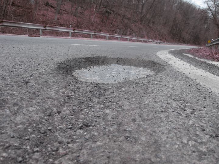 The entrance ramp for Saw Mill River Parkway North at Exit 32 out of Chappaqua is home to one of New Castle&#x27;s worst potholes.