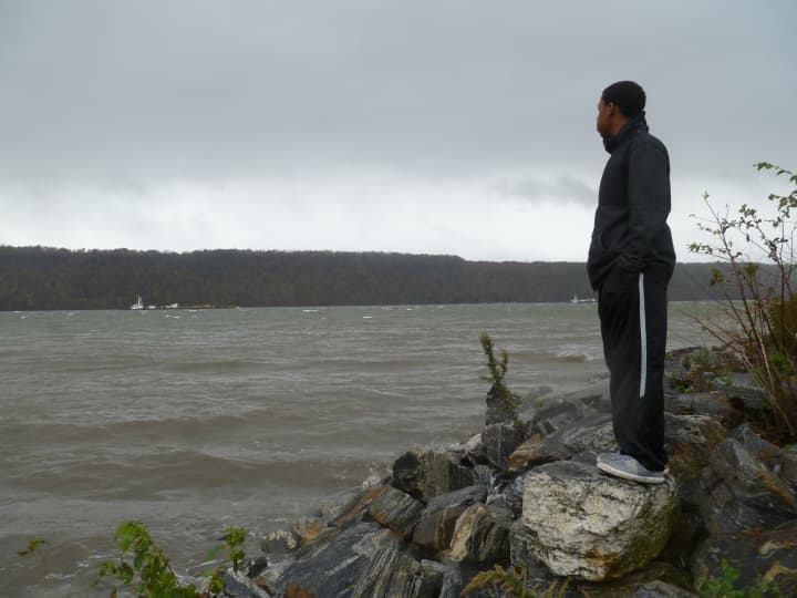 Roemelle Douglas, 17, looks out over the Hudson River earlier this year. It&#x27;s views of the Palisades like this that Yonkers residents say might soon be interrupted should LG Electronics build a high-rise building in Englewood Cliffs, N.J. 