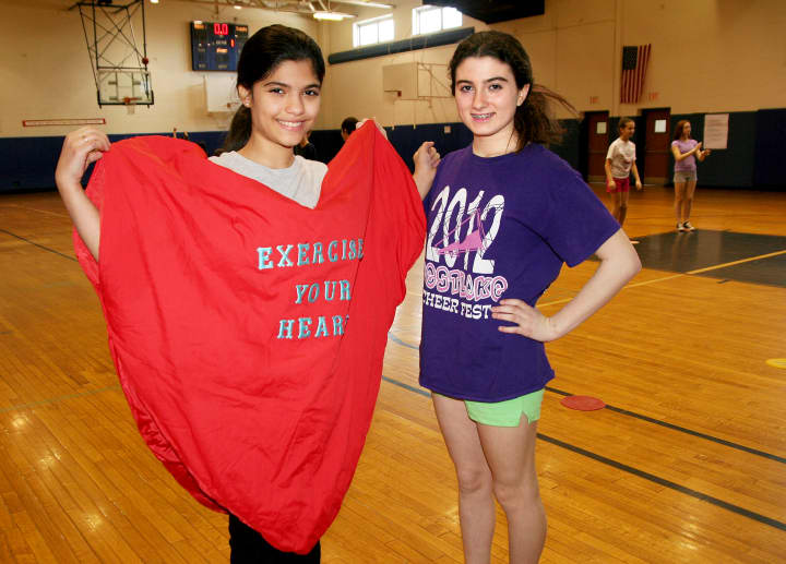 Westlake Middle School students Bianca Maniglia, left, and Caitlyn Lyions pose during the Hoops for Heart event.
