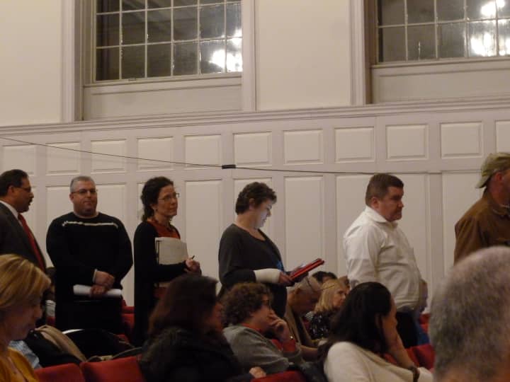 Several Norwalk parents line up during the Common Council meeting Tuesday night to speak in favor of education spending.