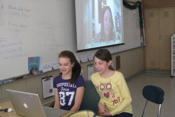 Fairfield Woods Middle School students share a Skype conversation with ESPN writer Stacey Pressman. 