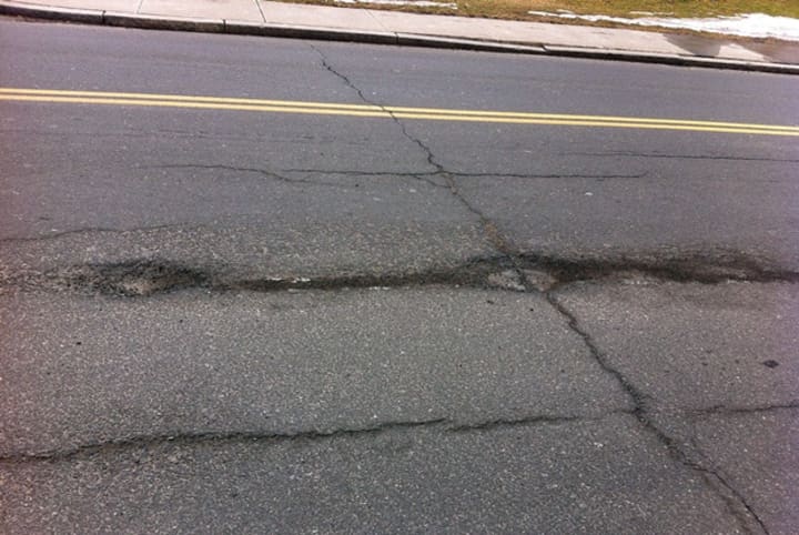 Pot holes are a fact of life for drivers. Here is a series of pot holes on Prospect Street next to the historic Ridgefield Library site.