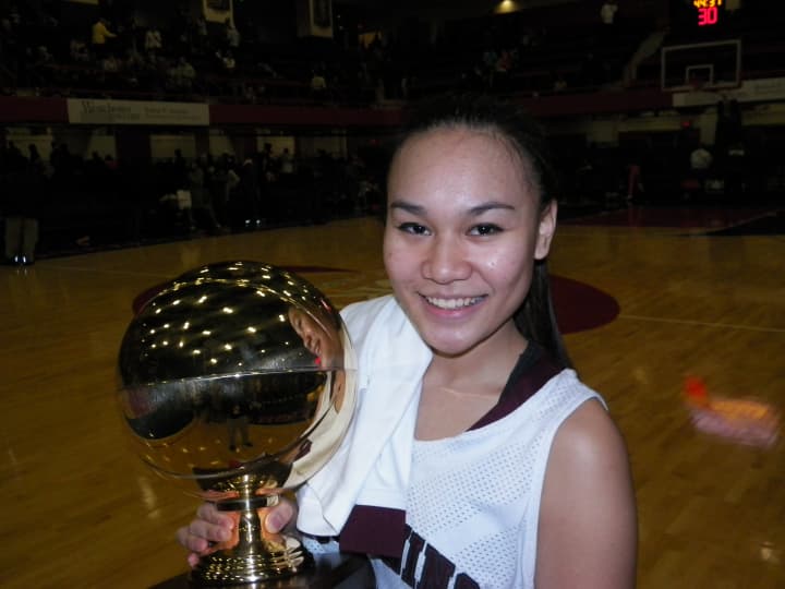 Ossining senior and captain Danielle Gervacio holds the gold ball after the Pride defeated Our Lady of Lourdes, 83-51 Sunday for their third consecutive Section 1 Class AA championship.