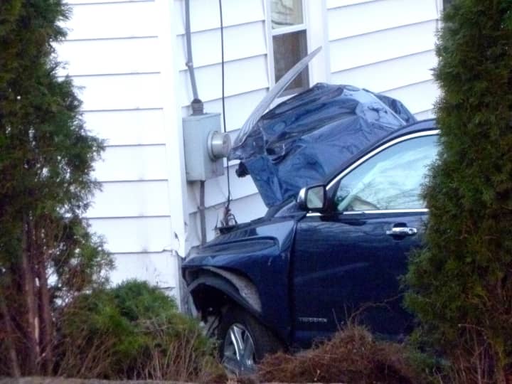 This blue sports utility vehicle smashed into this Stamford home, Tuesday evening. 