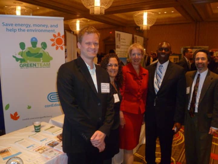 Dr. Marsha Gordon, (center) president and CEO of the Business Council of Westchester, talks to businesses in the green aisle at the 2012 Mega Mixer Business Expo. 