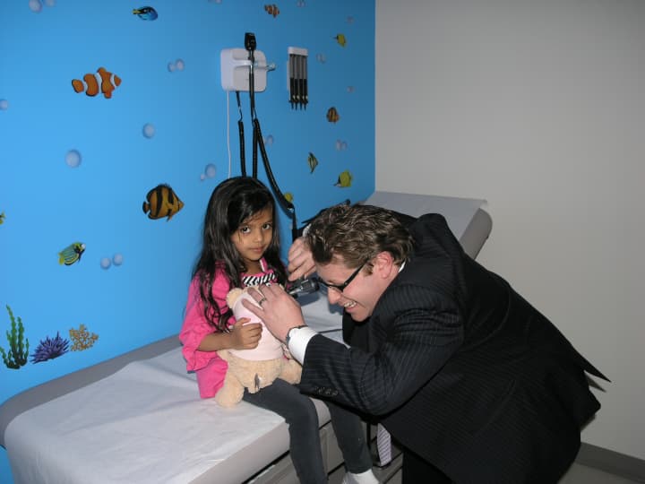 Dr. Jason Lupow does a check up at MDxpress&#x27; teddy bear clinic in Mamaroneck.