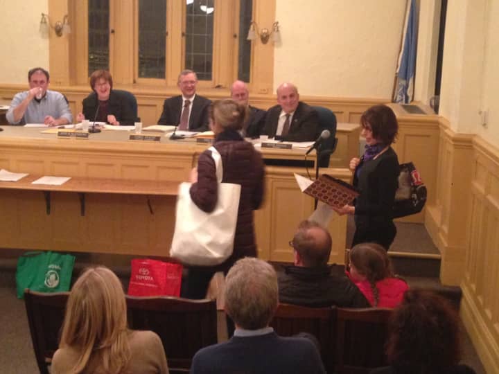 Proponents of the Reusable Bag Initiative show off their bags at Larchmont&#x27;s public hearing on the legislation Tuesday.