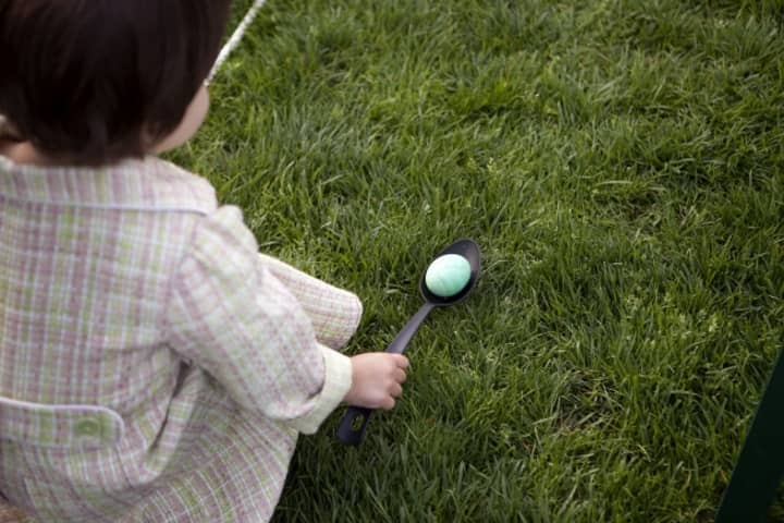 A young girl gets ready to roll her egg at the annual Easter Egg Roll on the South Lawn of the White House, April 5, 2010.
