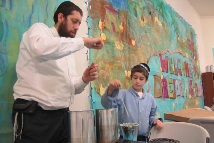Rabbi Dovid Labkowski, left, and Chabbad of Briarcliff Manor and Ossining will hold holiday services this week for Passover.