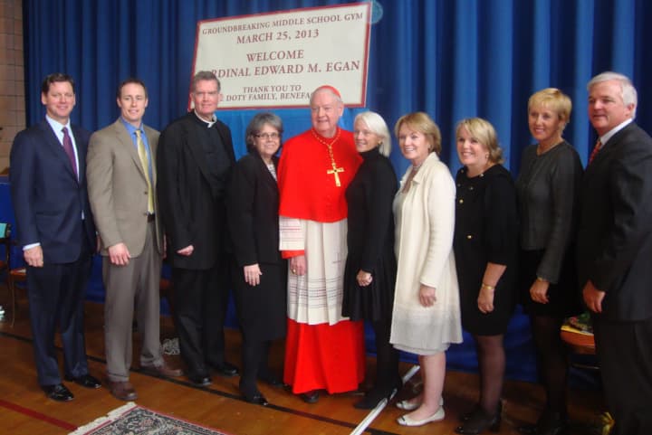 The staff of Resurrection School in Rye, along with Cardinal Edward Egan and the Doty family, celebrate the groundbreaking of a new school gymnasium.