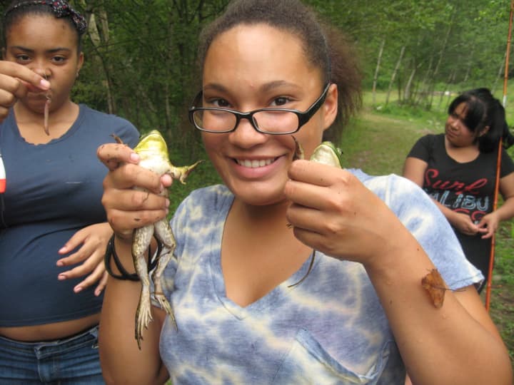 Campers play with frogs at Steve&#x27;s Camp, located in Livingston Manor, N.Y. 