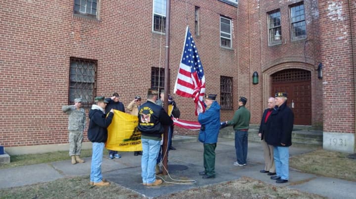 Veterans raise the American flag and the &quot;Don&#x27;t Tread On Me&quot; flag at the City Armory in New Rochelle.