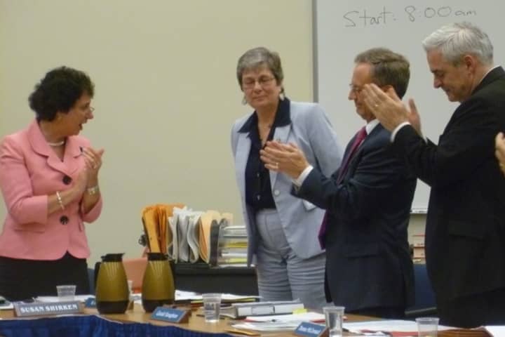 Edgemont Superintendent Nancy Taddiken (center) was given a standing ovation by members of the Edgemont Board of Education Tuesday after she announced her decision to retire at the end of the 2012-13 school year.