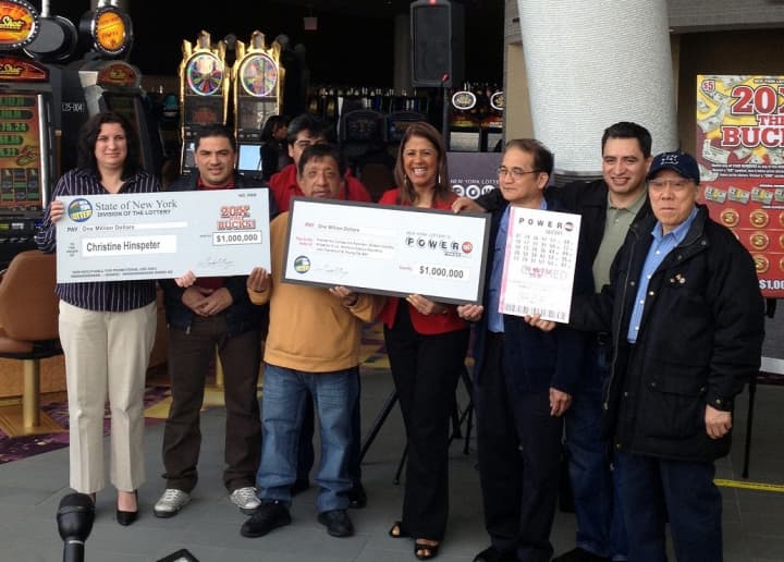 A group of lucky New York State Lottery winners are presented with their oversize checks Tuesday at Empire City Casino in Yonkers. 