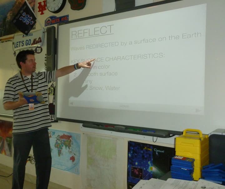 Michael Wing, a teacher at the Hommocks Middle School, uses iPads as a platform for his earth science lessons.