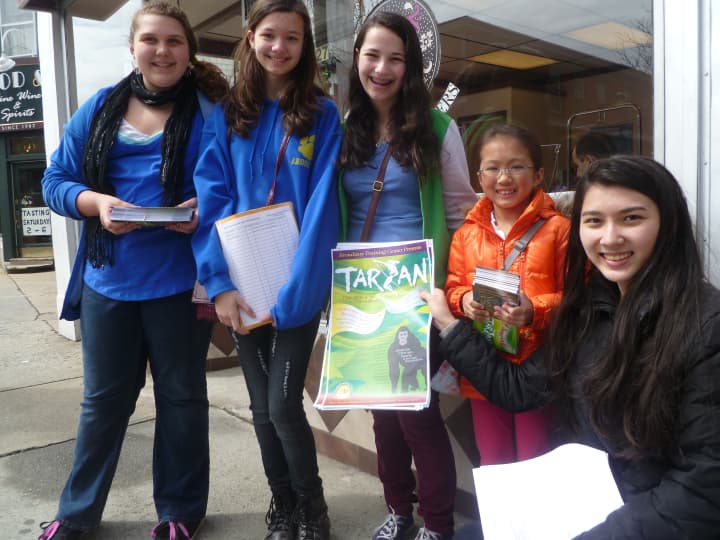 Broadway Training Center cast members distributed play posters in downtown Hastings for their upcoming production of &quot;Tarzan&quot;.