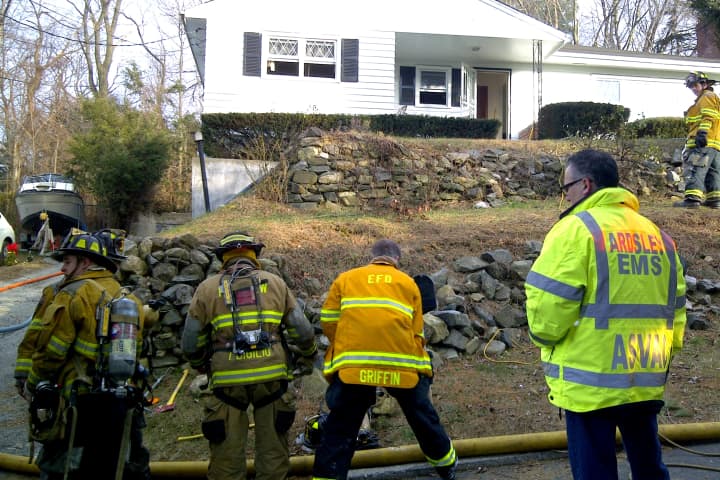 Elmsford firefighters work at the scene of a house fire. The department, along with the fire departments in Hartsdale and Fairview, is set to see thousands of dollars from a federal government grant program..