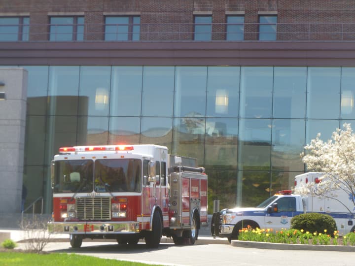 A fire truck and ambulance remain at the Stamford court house after a bomb threat was investigated Monday. 