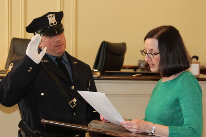 Rye Police Sgt. Michael Anfuso is sworn in by City Clerk Dawn Nodarse.