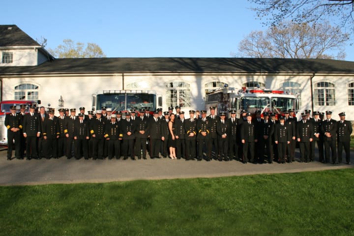 Firefighters pose in front of apparatus at the Croton Falls Fire Department Inspection Dinner.