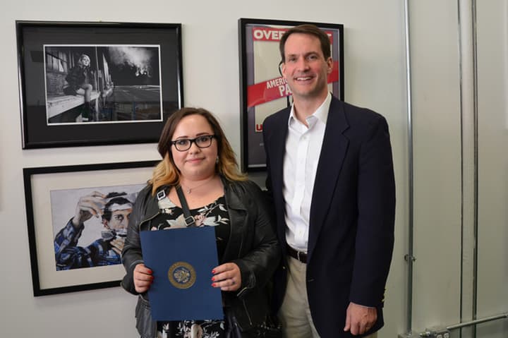 Fairfield Warde student Shannon Magnaldi poses with U.S. Rep. Jim Himes and her award-winning photo, &quot;Off-Peak.&quot;