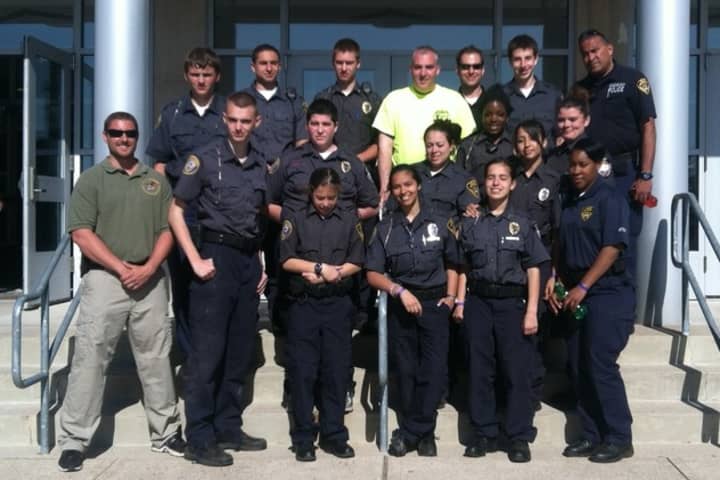 Greenburgh Police Explorer Christopher Keenan, back row, second from right, assisted an injured cyclist and alerted emergency medical technicians.