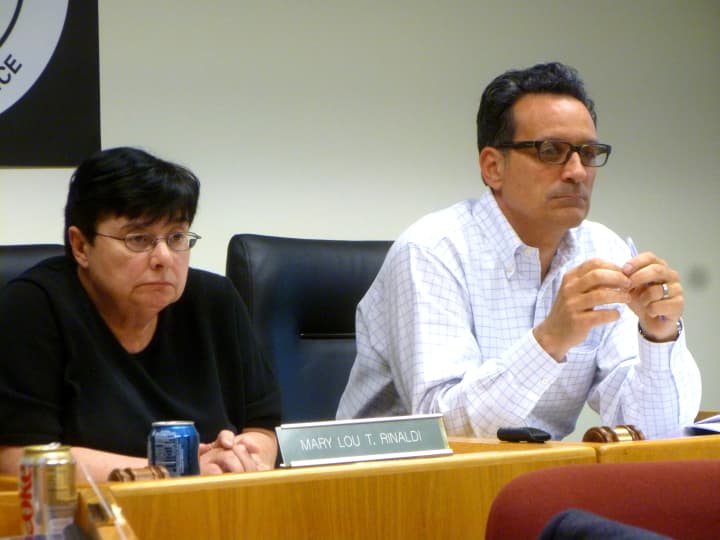 Board of Finance Members Mary Lou Rinaldi and Timothy Abbazia listen to a point during the board&#x27;s special meeting to set the Mill Rate for Stamford Tuesday night. 