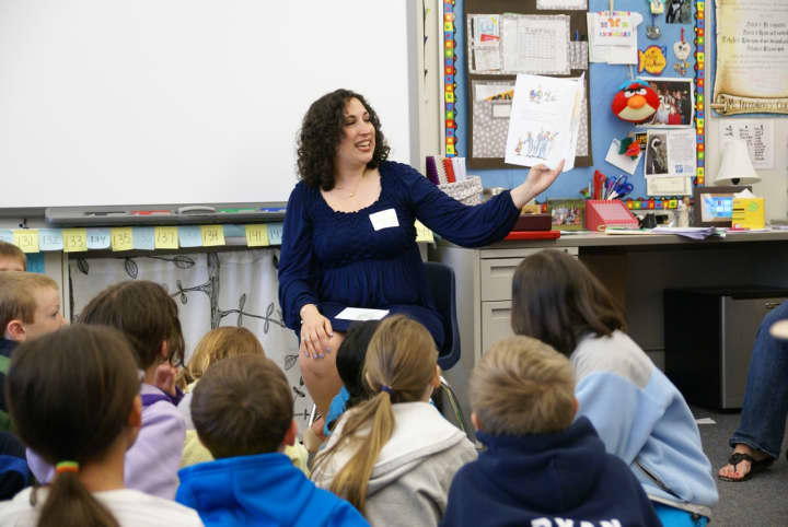 Marybeth Gioffre Nisco, chairwoman of the Wilton Education Foundation&#x27;s Read Aloud Day, reads to children at Cider Mill School Monday.