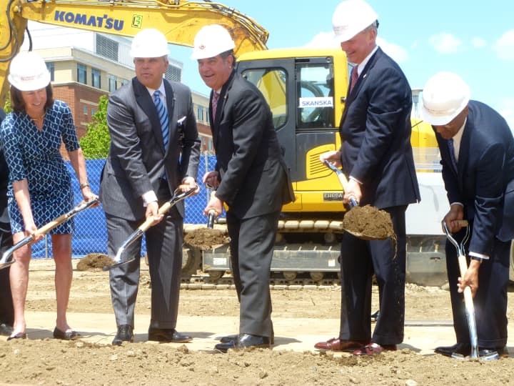 Mayor Michael Pavia and other dignitaries join Brian Grissler, president and CEO of Stamford Hospital, at a groundbreaking ceremony for the construction of a new hospital. 