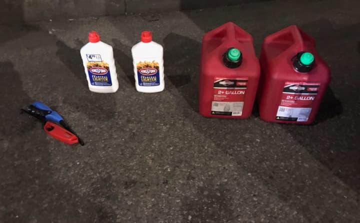The NYPD tweeted a photo of the gas cans, lighter fluid and lighters seized from Lamparello.