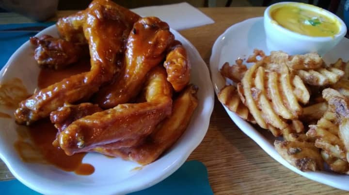 Teriyaki/hot mix of wings and waffle fries with jalapeno cheese sauce at the Candlelight Inn in Scarsdale.