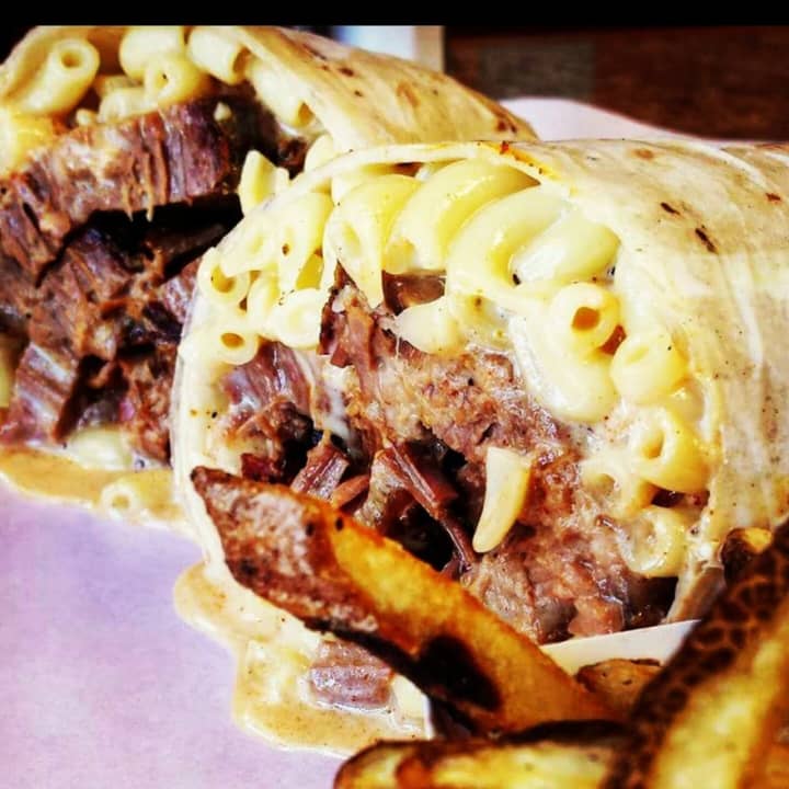 Smoked brisket wrap stuffed with mac n&#x27; cheese and bacon from Sempre Fame in Floral Park (374 Tulip Avenue)