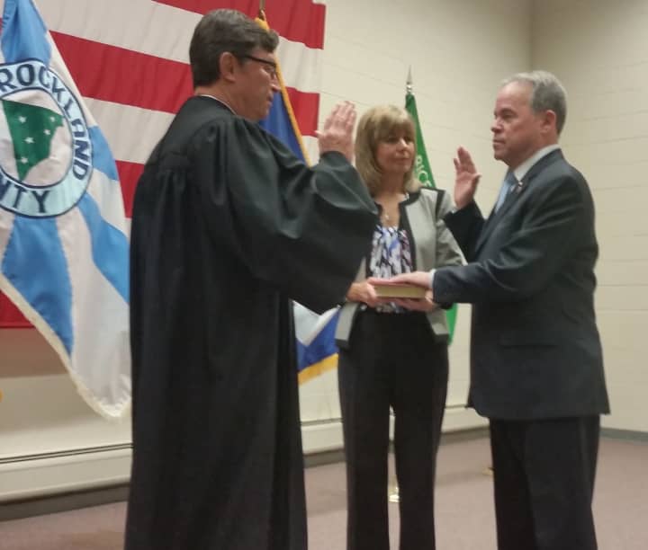 Rockland County Executive Ed Day accompanied by his wife, Jean, takes the Oath of Office, administered by Clarkstown Justice Craig E. Johns earlier this month.