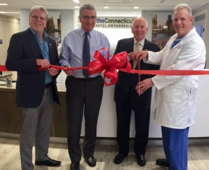 First Selectman Jim Marpe, Dr.’s Nicholas Polifroni and Michael Lynch, and Westport Weston Chamber of Commerce Executive Director Matthew Mandell celebrate the opening of the new OrthoConnecticut in Westport