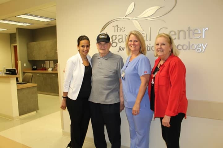 Peter Chisick with members of the radiation oncology team at Putnam Hospital Center including radiation therapy supervisor, Nicole Cimadomo (far left), registered nurse Diane Maher and oncology nurse navigator Dianne Toscano.
