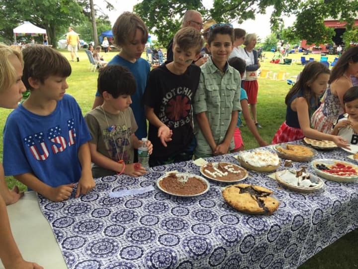 Kids line up to taste pies at Saturdays Second Annual Rock &#x27;N Roots Revival Music Festival at Lonetown Farm in Redding.