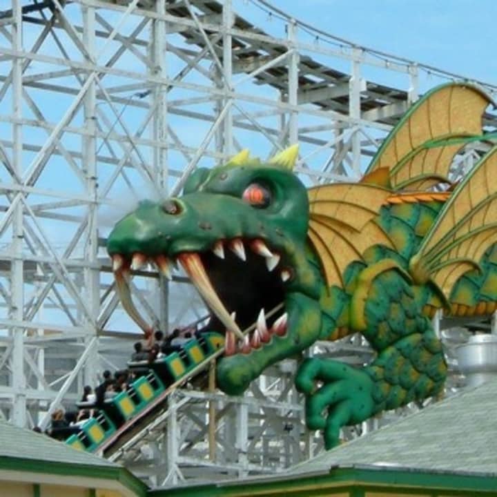 Amusement parkgoers ride the Dragon Coaster at Playland in Rye. Lawmakers are considering a reduced cost for park renovations in exchange for new management.
