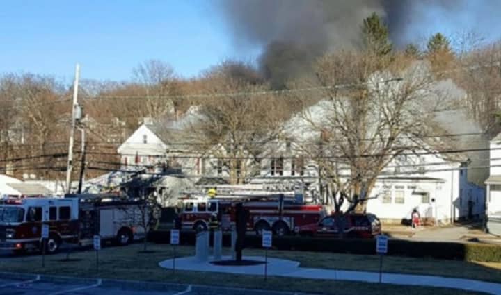 Poughkeepsie firefighters battle a two-alarm blaze that started outside 163 N. Hamilton St. on Monday, Feb. 29, and spread to a neighboring home.