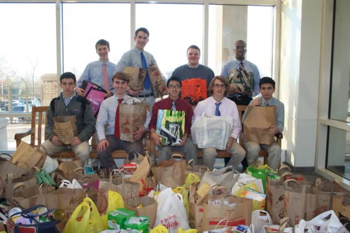 Members of Fairfield Prep&#x27;s Squires Club and friends prepare for their annual Thanksgiving food drive. 