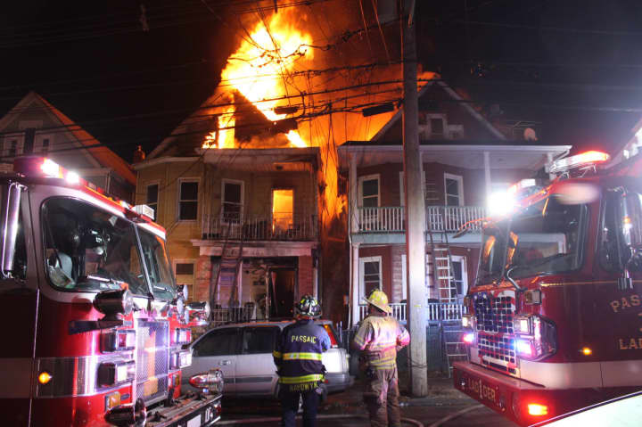 The Jackson Street fire in Passaic spread to a neighboring home.