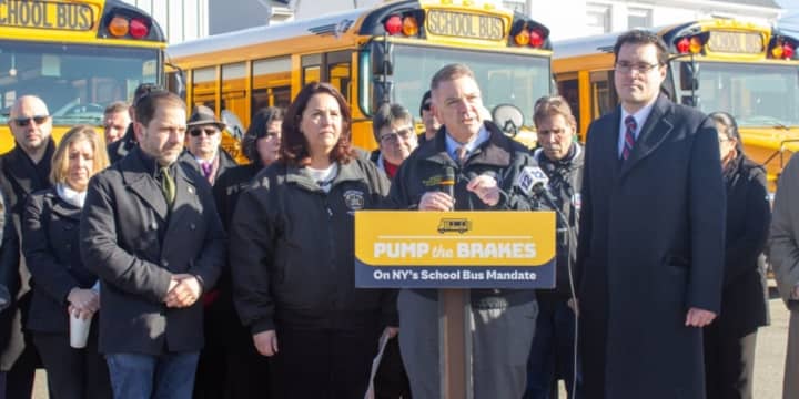New York state lawmakers, fire safety, and school officials rallied at the Levittown Bus Depot on Sunday, Feb. 25 to oppose an electric school bus mandate.