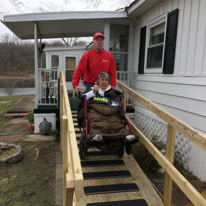 Peter Brady who founded Handy Dandy Handyman Ministries and Epy Lawson try out the newly built ramp at her home in Danbury.