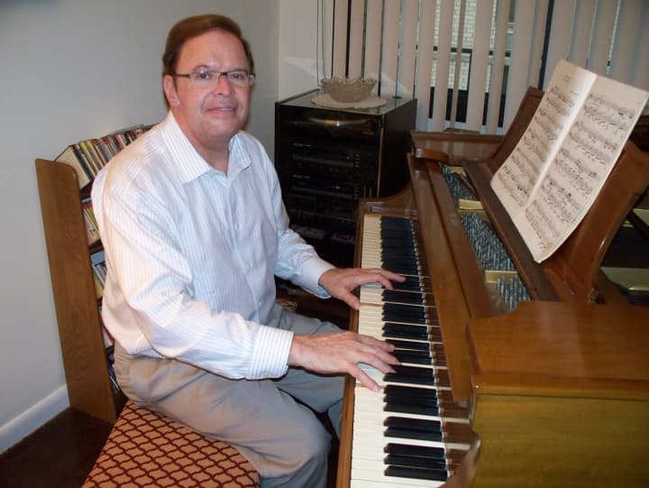 Randy Wine sits in front of his circa 1908 handmade Steinway piano in his Hackensack condominium.