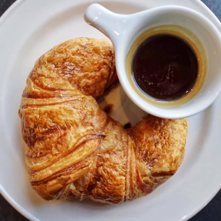 An espresso at Neat in Darien is shown paired with a croissant from SoNo Baking Company &amp; Café,