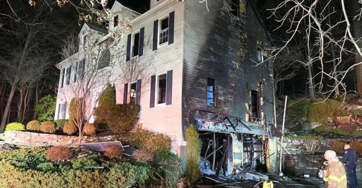 A Stamford home received extensive damage during a two-alarm fire.