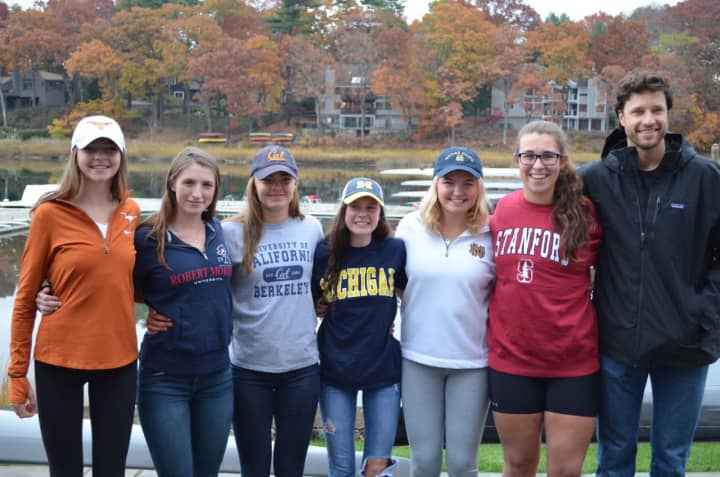 Saugatuck Rowing Club athletes signed National Letters of Intent to continue their careers in college. The girls (left to right) are  Sophie Pendrill, Katelyn DeAgro, Imogen Ratcliffe,  Charlotte Powers, Kate Johnson and Grace McGinley.